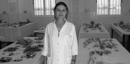 A staff member at the UN committee of the missing persons in Cyprus with bones laid out on the tables waiting to be identified.